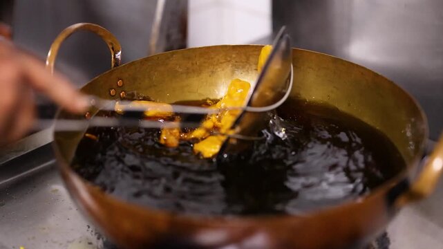Deep Frying Indian Pakora Fritters in a Traditional Brass Kadai Wok