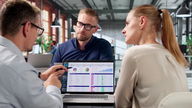 Medical Biller And Coder Analyzing Spreadsheet Data