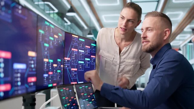 Software Developers Collaborate Using Visual Drag And Drop Tools