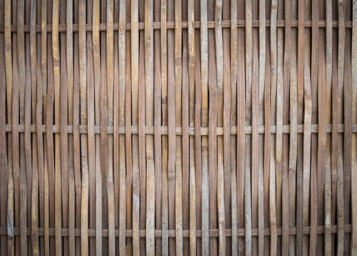 Vertical woven bamboo texture background, rustic bamboo fence wall.