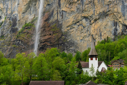 Lauterbrunnen valley church and Staubbach Falls in Switzerland