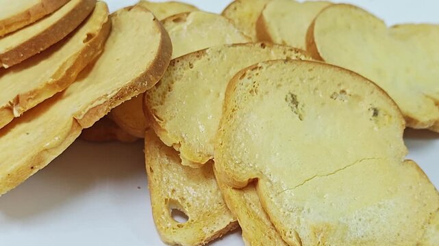 Macro shot of crispy baked bread rusks and toast texture background.