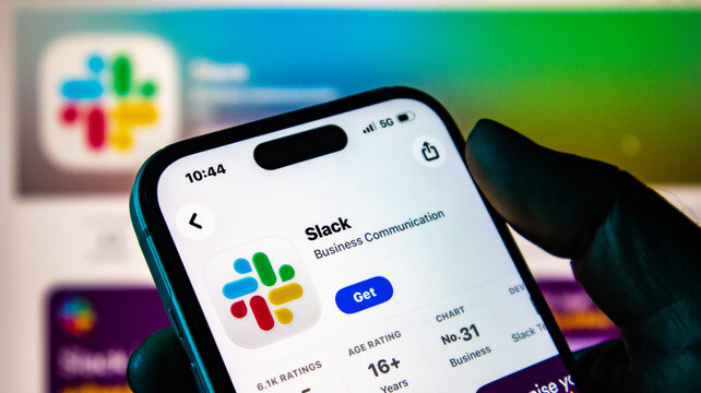 Closeup of a smartphone screen displaying the slack app page in the apple app store, showing app details and rating