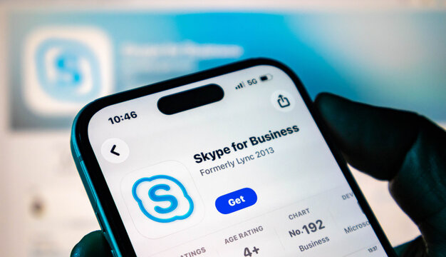 Closeup of a smartphone screen showing the skype for business app download page on an app store