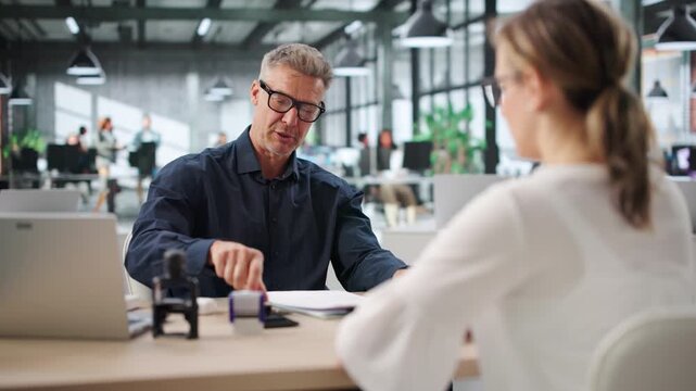Man Stamping Important Property Document