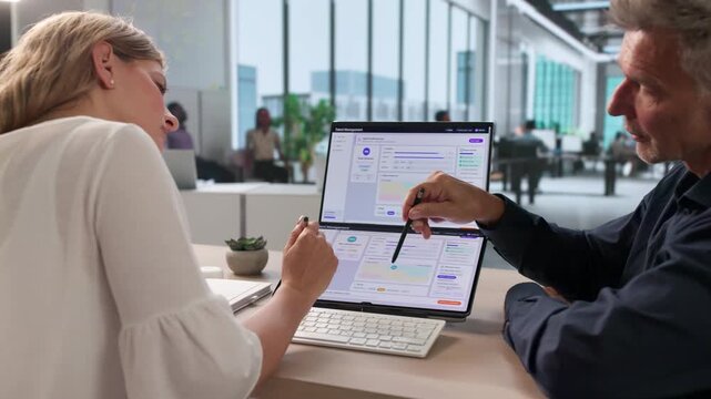 HR Manager And Team Using Software