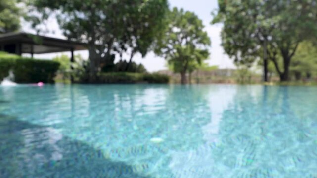 Abstract blur outdoor swimming pool in tropical resort hotel summer background