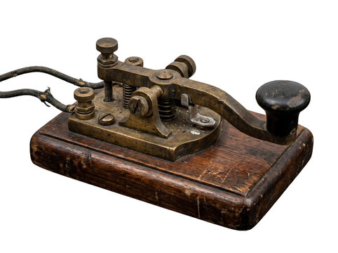 Vintage brass telegraph key for morse code communication mounted on weathered wooden base isolated on transparent background