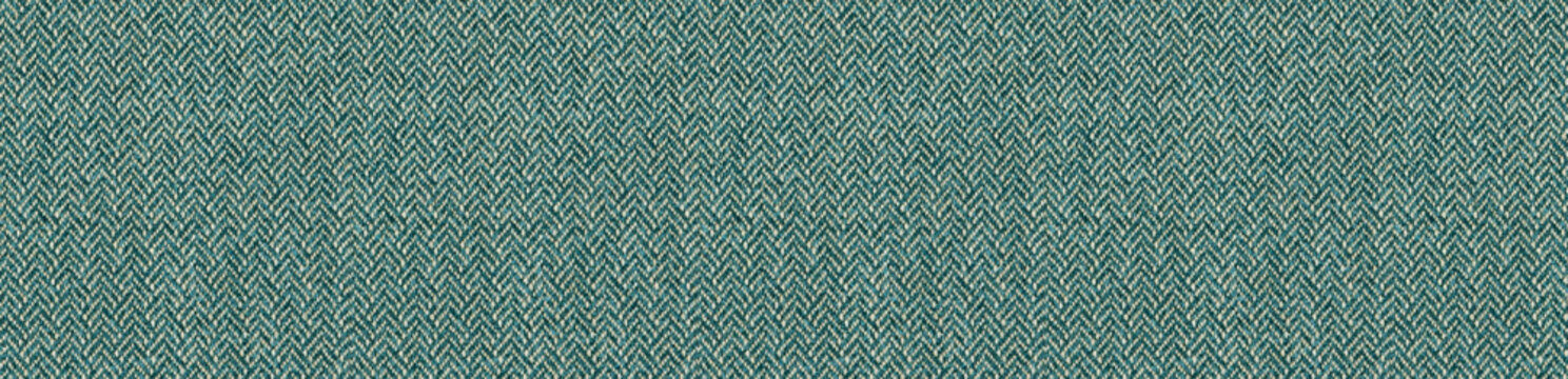Vibrant teal herringbone fabric texture with a classic chevron pattern suitable for modern upholstery and elegant textile backgrounds.