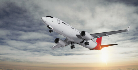 Naklejka premium Commercial passenger airplane flying above clouds at beautiful sunset.