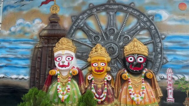 Lord Jagannath Balabhadra and Subhadra Idols with Puri Temple and Wheel Background


