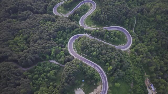 Aerial view of winding asphalt mountain road among green trees in summer. (Domani&ccedil;,İneg&ouml;l dağ yolu)