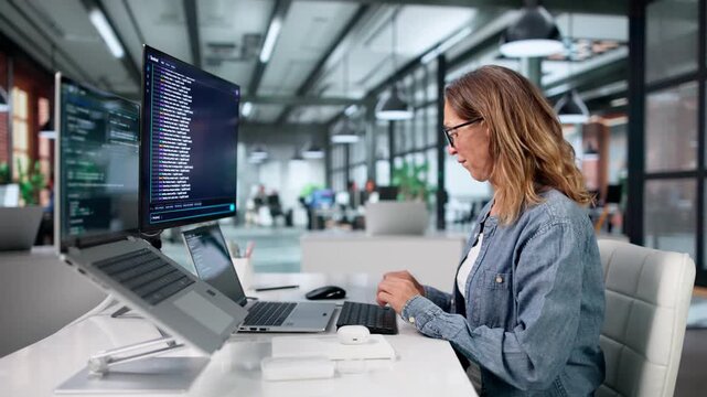 Experienced Female Developer Coding Software