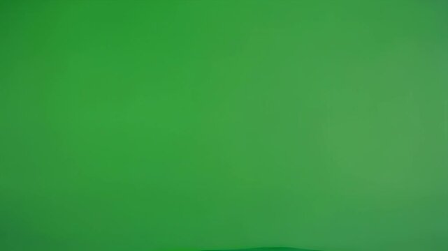 A simple, solid green background with a smooth, uniform texture and vibrant hue.