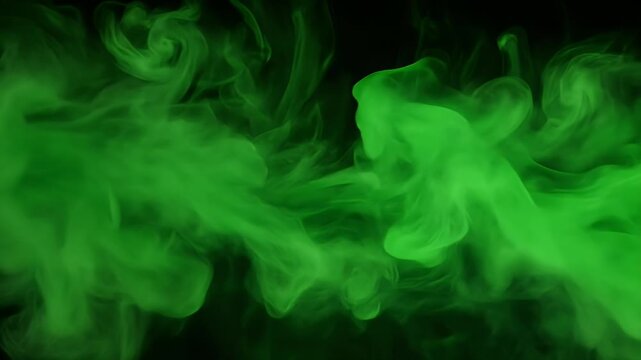 Green smoke swirling and flowing against a dark background, creating an abstract and mysterious atmosphere.