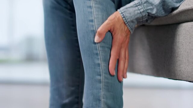 Mature Woman Gently Rubs Leg Easing Muscle Cramp