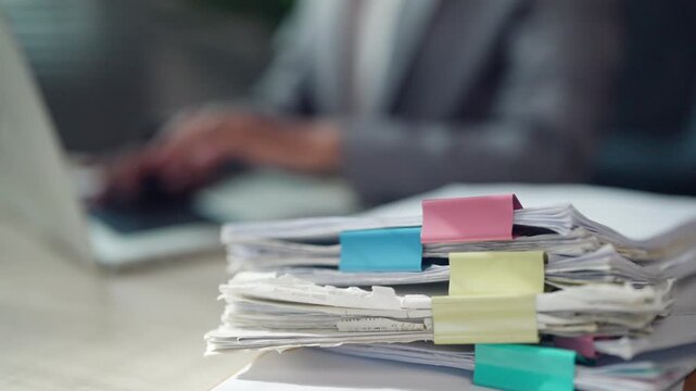 Office Documents with Binder Clips on Business Desk