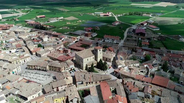 Aerial view of historic town center in Astudillo with central church