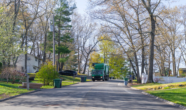 trash collecting truck on residential street