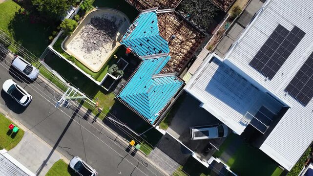 Aerial Top Down View of Residential Roof Renovation and Construction