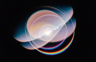 Naklejka premium Overlapping circular light flares with chromatic aberration against a dark background circles flare lights optical phenomenon refraction reflection