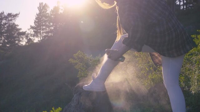 Woman Applying Mosquito Repellent on Legs Before Camping Nature Walk or Summer Outdoor Recreation