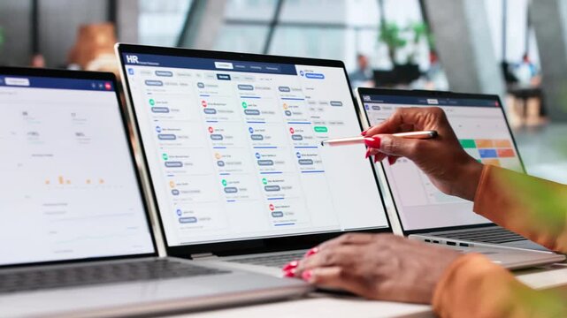 Human Resource Manager Reviews Employee Data