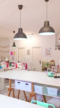 Fashion designer working inside her sewing workshop
