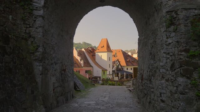 Beautiful shot of the historic Cesky Krumlov illuminated by the warm golden light of a sunrise. Czechia, UNESCO World Heritage Site