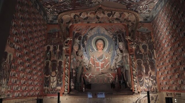 The mural art of the Mogao Grottoes in Dunhuang, China: Ancient Eastern art. Ancient Chinese murals, Mogao Grottoes in Dunhuang, Gansu Province, Buddhist statues, painted sculptures, and mural art.