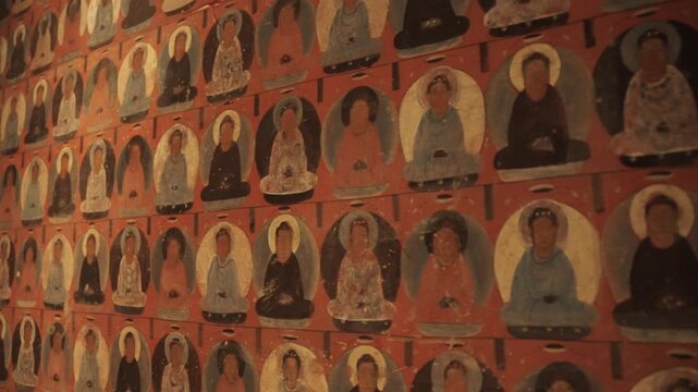 The mural art of the Mogao Grottoes in Dunhuang, China: Ancient Eastern art. Ancient Chinese murals, Mogao Grottoes in Dunhuang, Gansu Province, Buddhist statues, painted sculptures, and mural art.