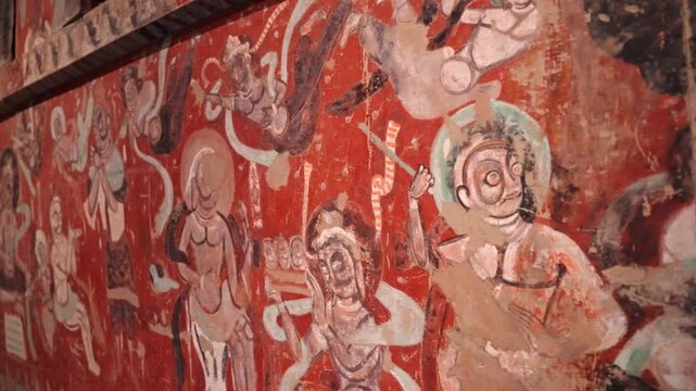 The mural art of the Mogao Grottoes in Dunhuang, China: Ancient Eastern art. Ancient Chinese murals, Mogao Grottoes in Dunhuang, Gansu Province, Buddhist statues, painted sculptures, and mural art.