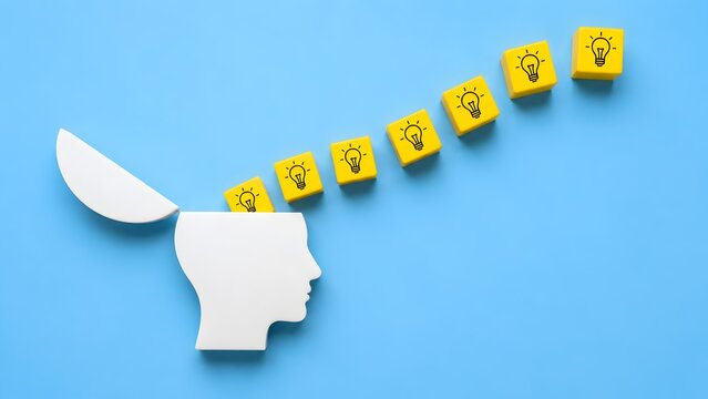 Knowledge acquisition and inspiration concept showcasing a human head absorbing yellow lightbulb idea blocks for creative growth