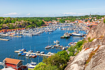 Obraz premium Scenic coastal harbor view with boats in the marina at Grebbestad a coastal village on the Swedish west coast