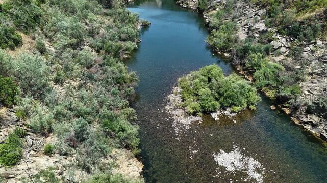 Aerial view of Castelo do Bode Dam and the surrounding river in Portugal.
4K high quality cinematic nature footage.
