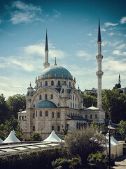 Naklejka premium Mosque in Istanbul against the backdrop of a beautiful sunset sky. Byzantine type of mosque.