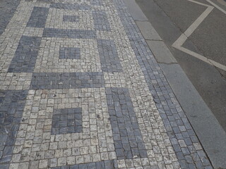 Fototapeta premium cobble tiles pattern on a street in city