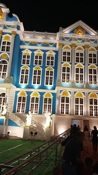 18 October 2023, Howrah, West Bengal, India. Panning night view of a colorful Durga Puja pandal. The footage highlights exterior decorative figures and a crowd worshiping the beautiful Goddess idol.