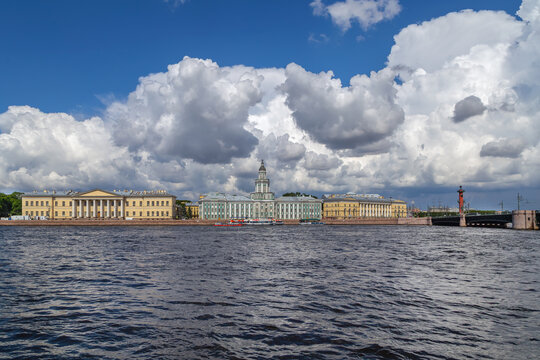 View of University embankment and Kunstkamera in Saint Petersburg, Russia. Panoramic view from Neva river on a summer day