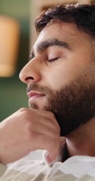 Man, thinking and regret with doubt in home for past moment, mistake or mental health. Thoughtful, male person or vision with stress, concern or contemplation for bad history or rumination in house