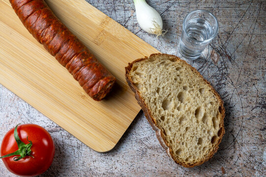 Traditional Hungarian Peasant Breakfast with Sausage Bread and P&aacute;linka