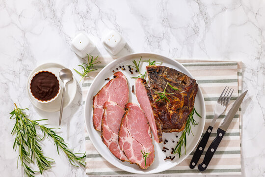 Smoked and baked pork collar on a plate