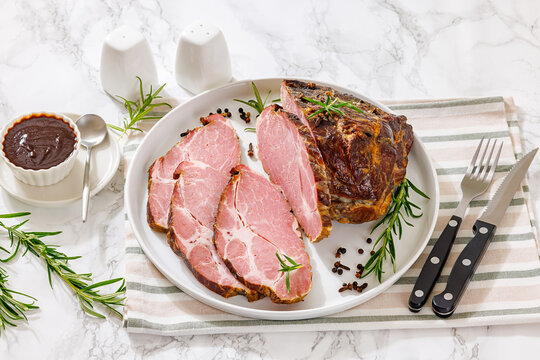 Smoked and baked pork collar on a plate