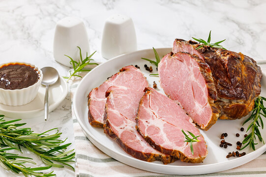 Naturally cured pork coppa roast is on a plate