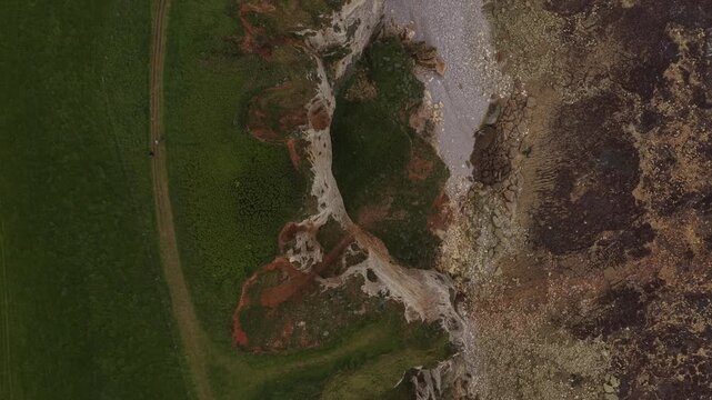 Aerial over white chalk cliffs of &Eacute;tretat along the Alabaster Coast in Normandy, France