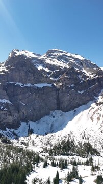 Simmental valley near Lenk in the Canton of Bern, Switzerland alpine nature winter, vertical video