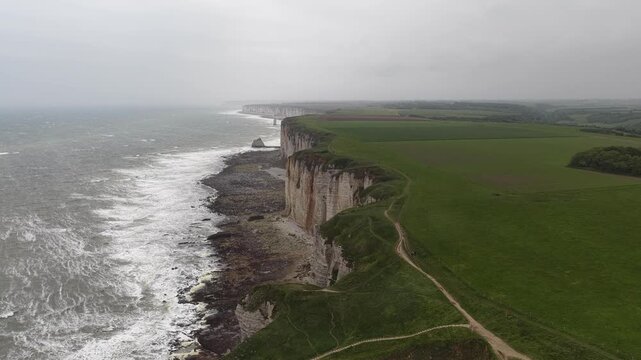 Dramatic white chalk cliffs of &Eacute;tretat along the Alabaster Coast in Normandy, France
