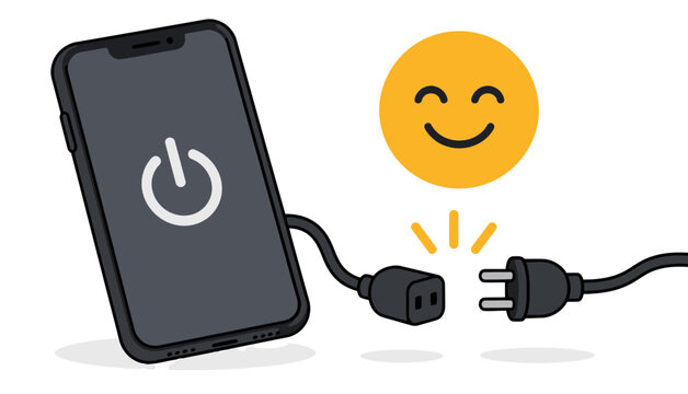Unplugged happy power plug next to a turned off smartphone
