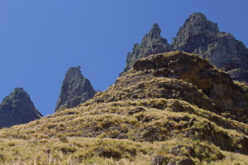 Fototapeta premium Views along the scenic hiking trail ascending from San Pedro,descending from the high threshing ground Era de Berbique toward the coastal village of Puerto de las Nieves in northwest Gran Canaria, Can