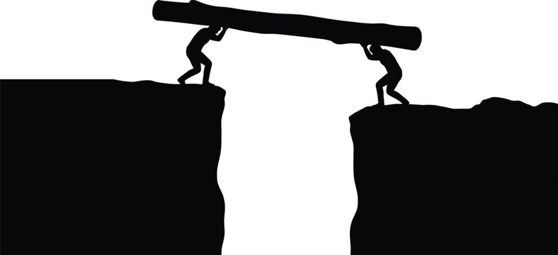 Silhouette of two people carrying a wooden log to bridge a gap between two cliffs